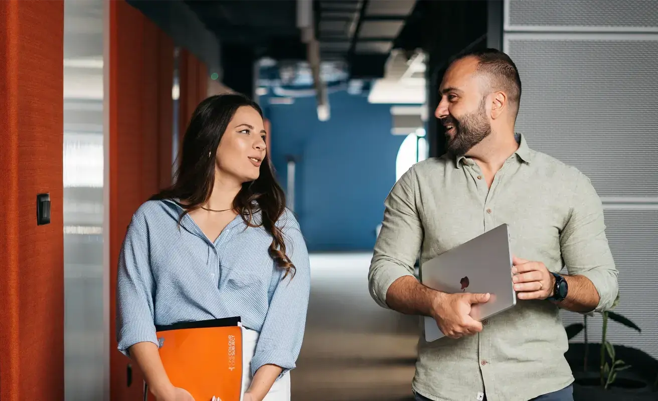 two Endava colleagues walking in building