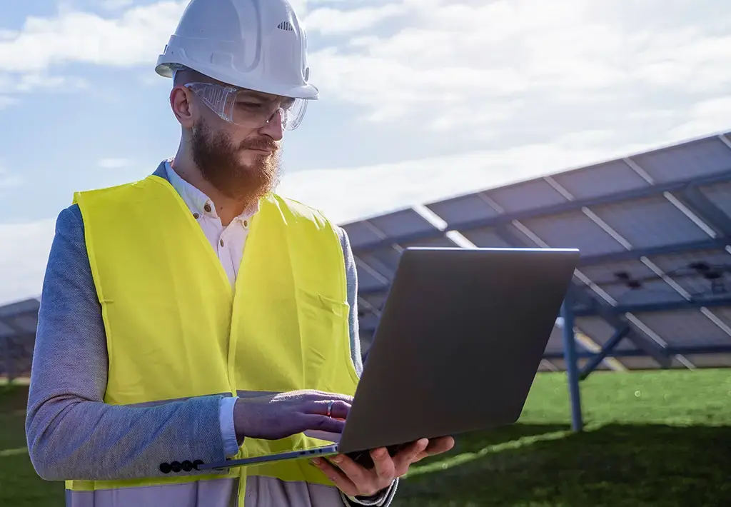 energy-engineer-holding-laptop-carousel-insight-expanded