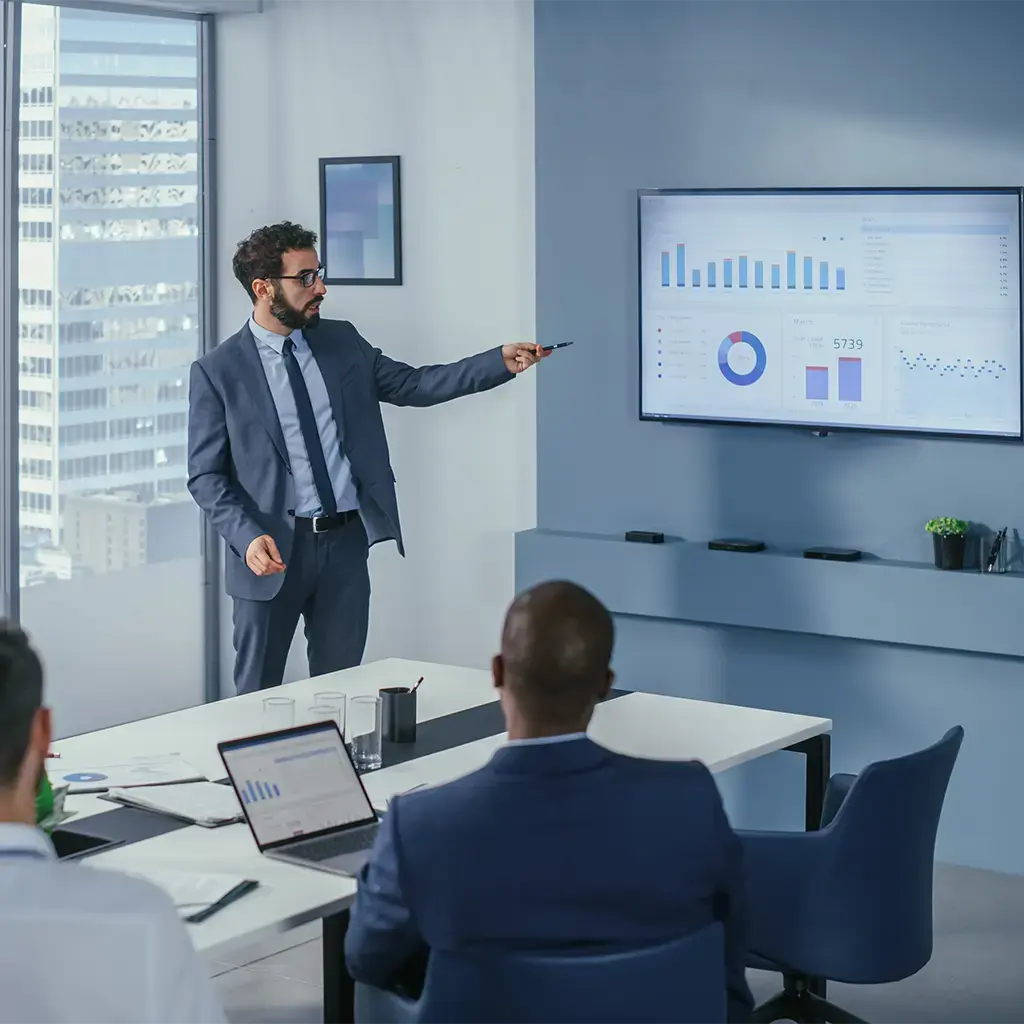 office worker giving presentation in meeting room