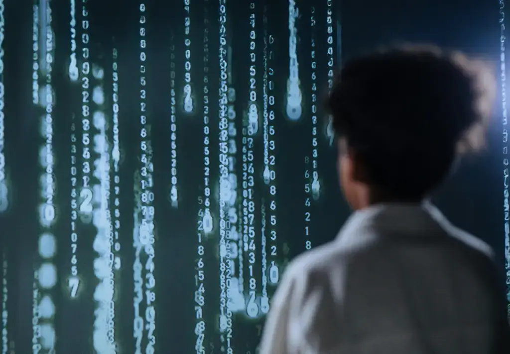 Person analyzing glowing blue data projections, representing AI-driven innovation in financial services.