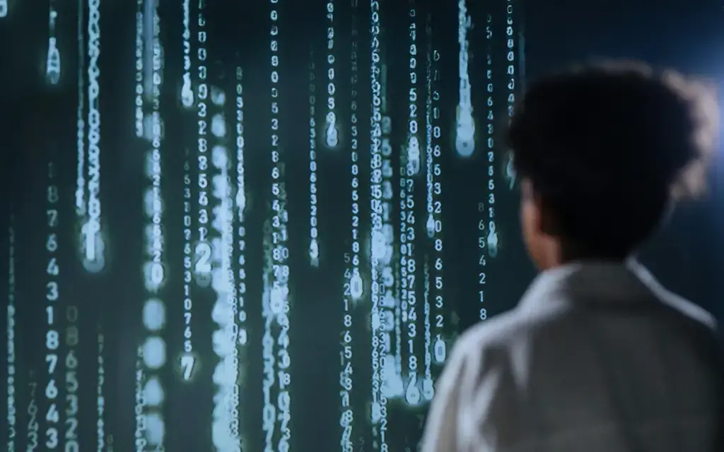 Person analyzing glowing blue data projections, representing AI-driven innovation in financial services.