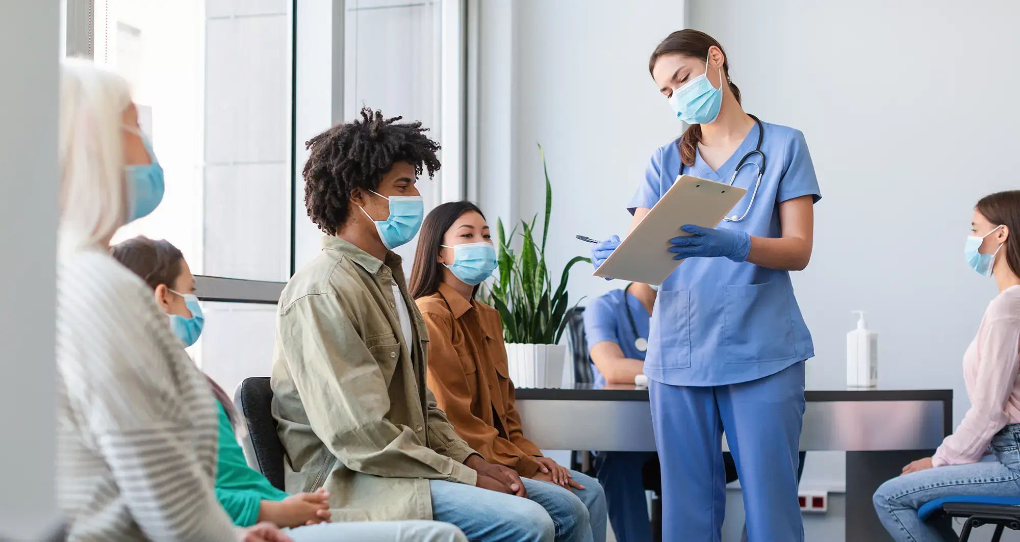 A nurse and patients at a clinical trial
