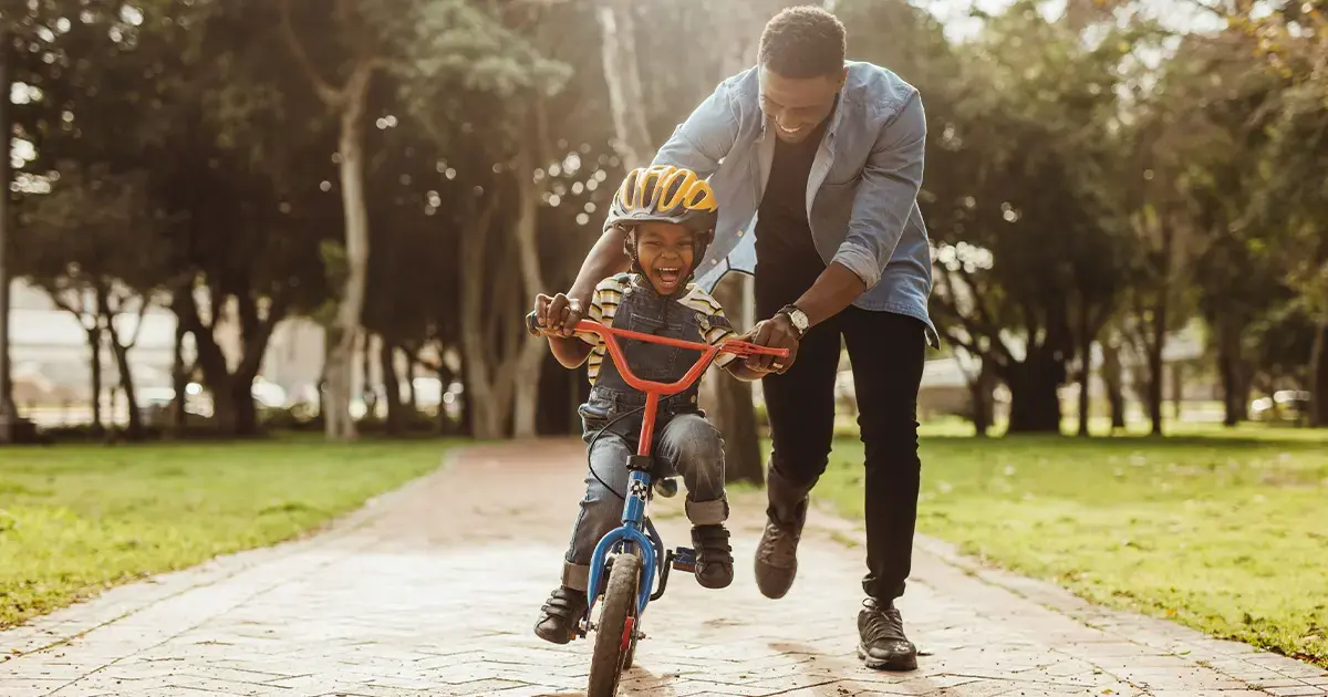 boy-learning-ride-bicycle-his-father-featured-image