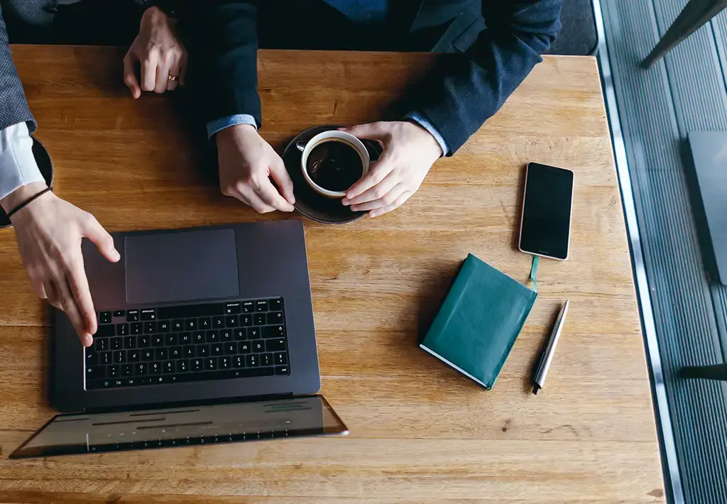 two-businessmen-pointing-laptop-carousel-insight-expanded