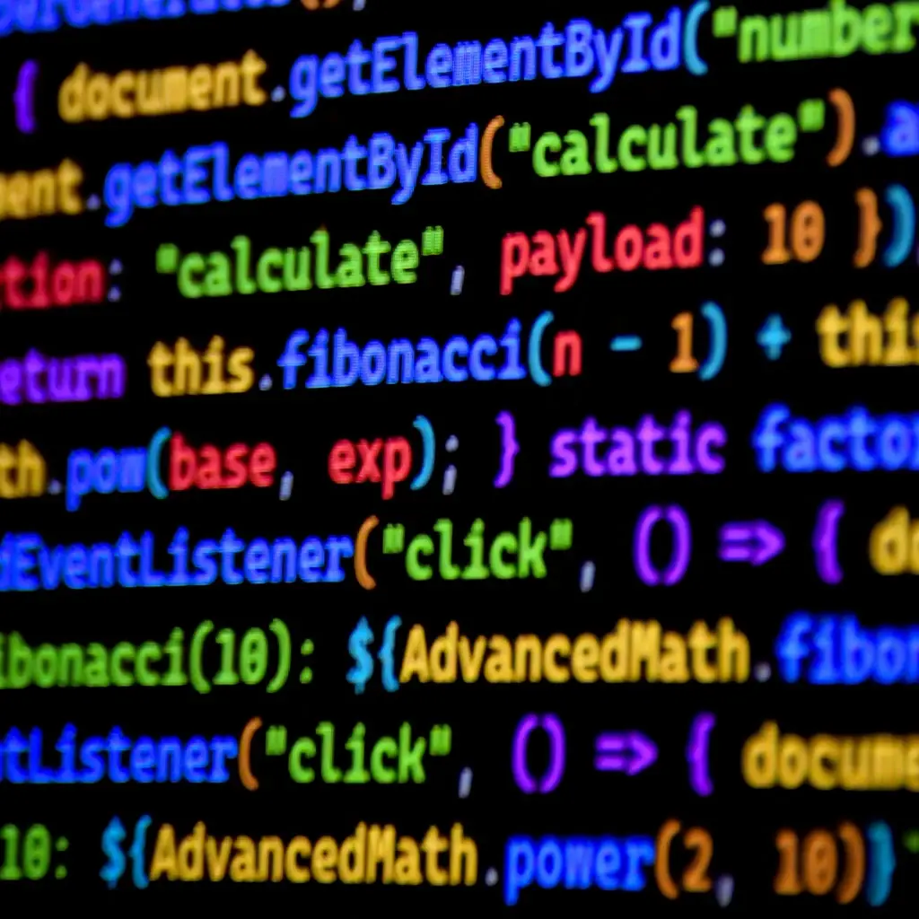 Colorful programming code on screen showing functions and calculations, representing software development and coding