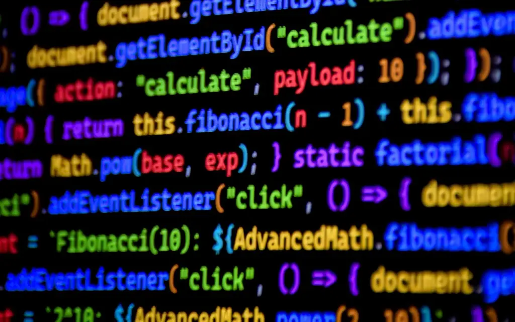 Colorful programming code on screen showing functions and calculations, representing software development and coding