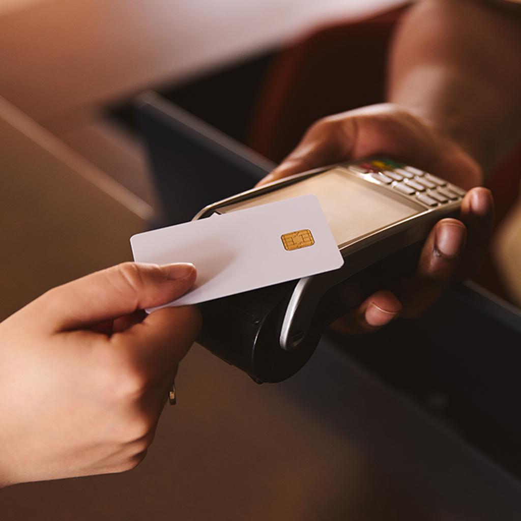 customer using credit card with payment processing device