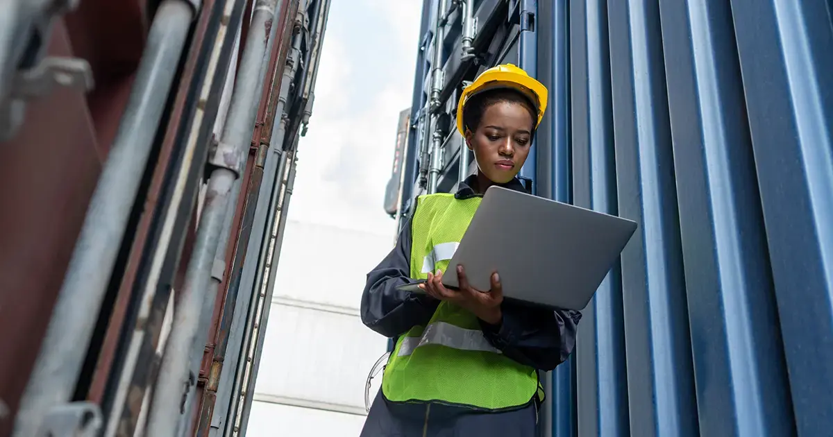 female-employee-checking-computer-in-industrial-location-featured-image