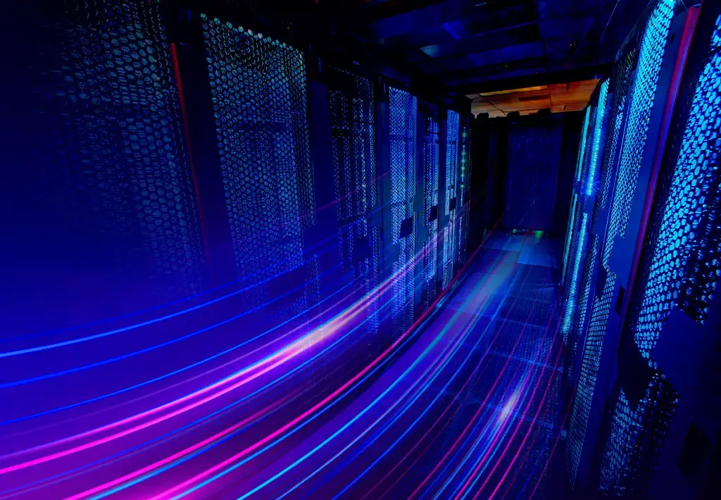 Data center server racks with dynamic light trails representing high-speed data transfer.