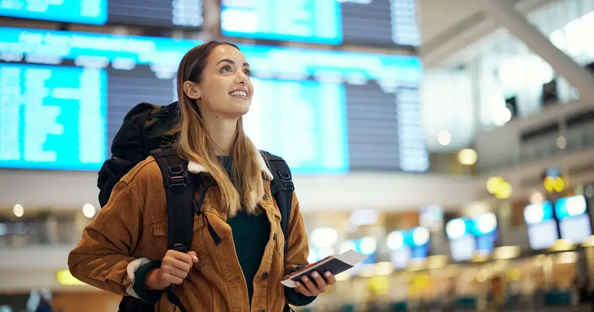 woman-with-backpack-transportation-hub-featured-image