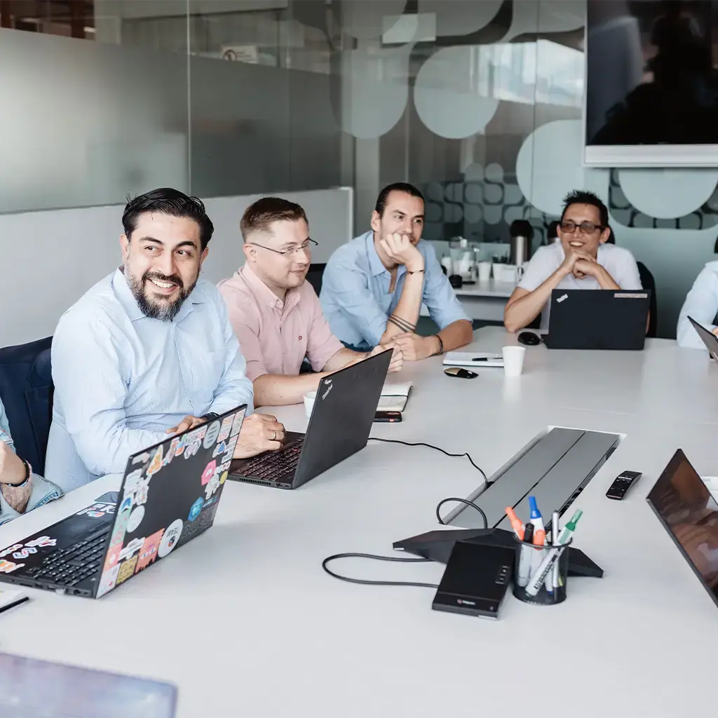 Team meeting in a modern conference room, discussing a new business partnership