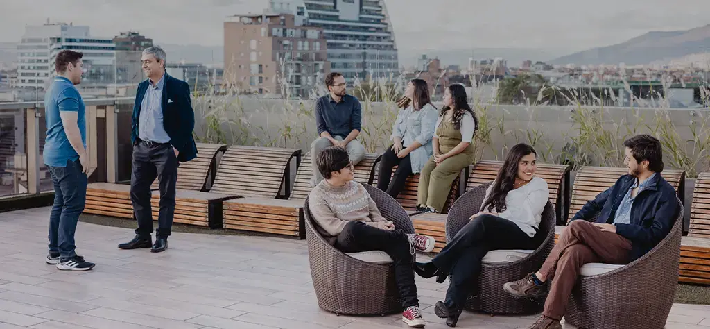team-rooftop-meeting-cityscape-card-pillars-3