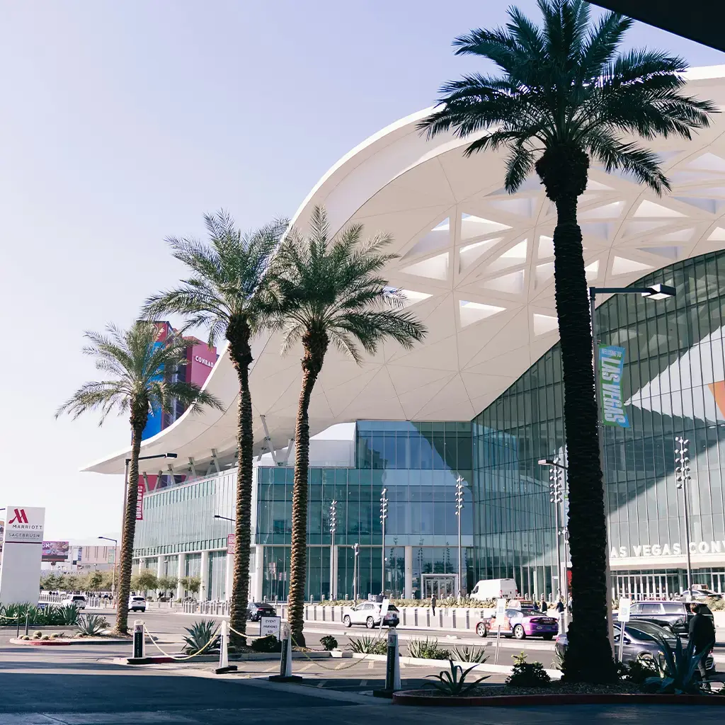Las Vegas Convention Center exterior with glass facade and palm trees