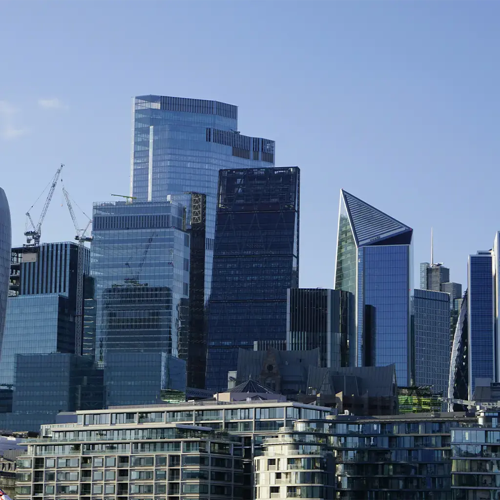 Glass high-rise offices in central London, highlighting technology-led change for banking and capital markets.