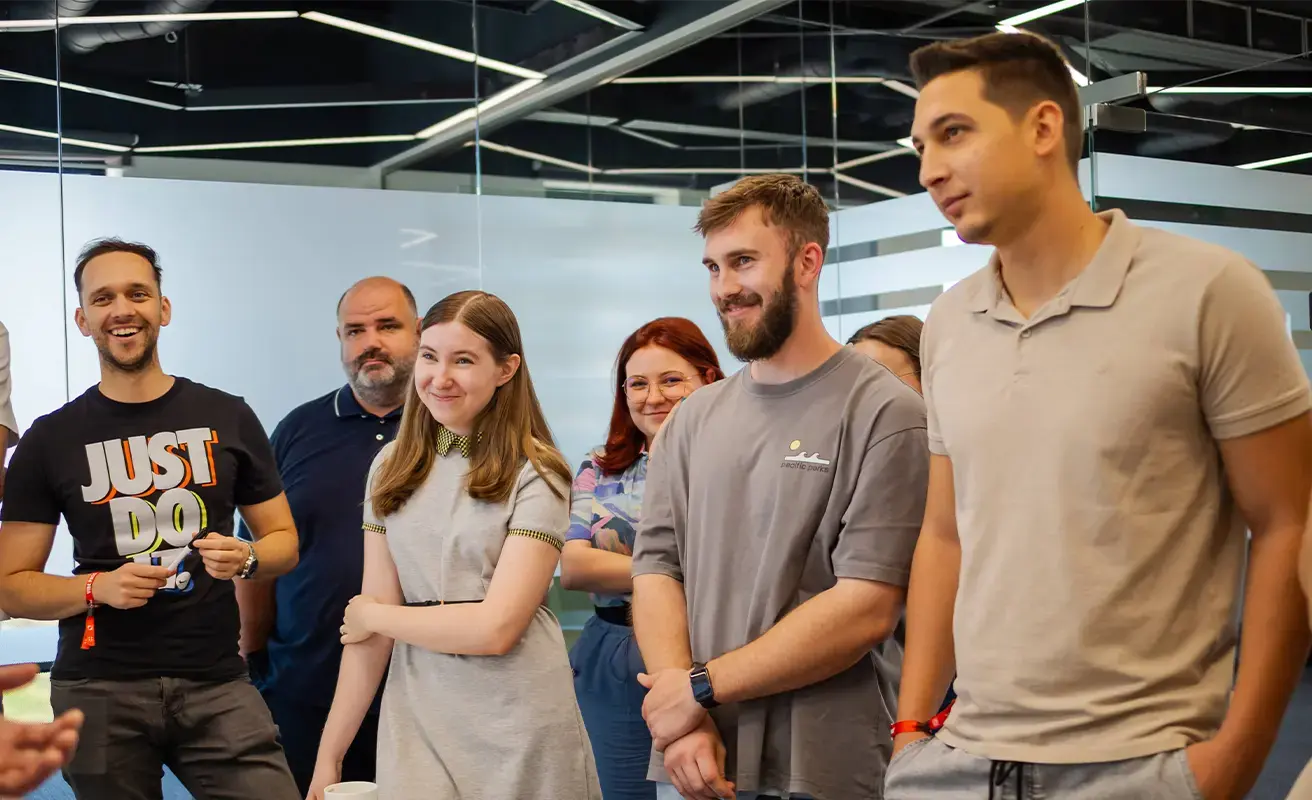 Team members engaged in a collaborative discussion in a modern office environment.