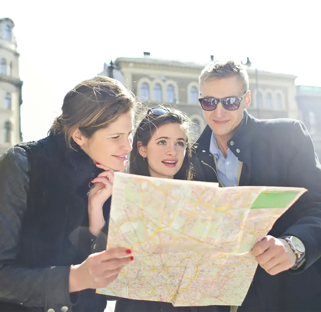 Group holding map and exploring a new city