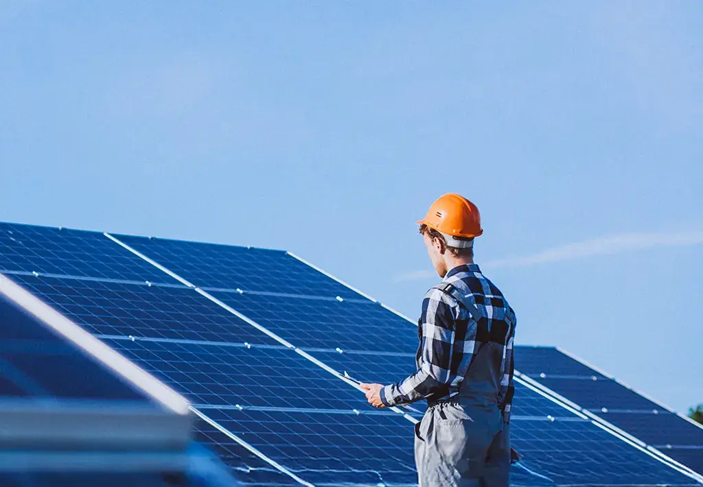 person working on solar panels