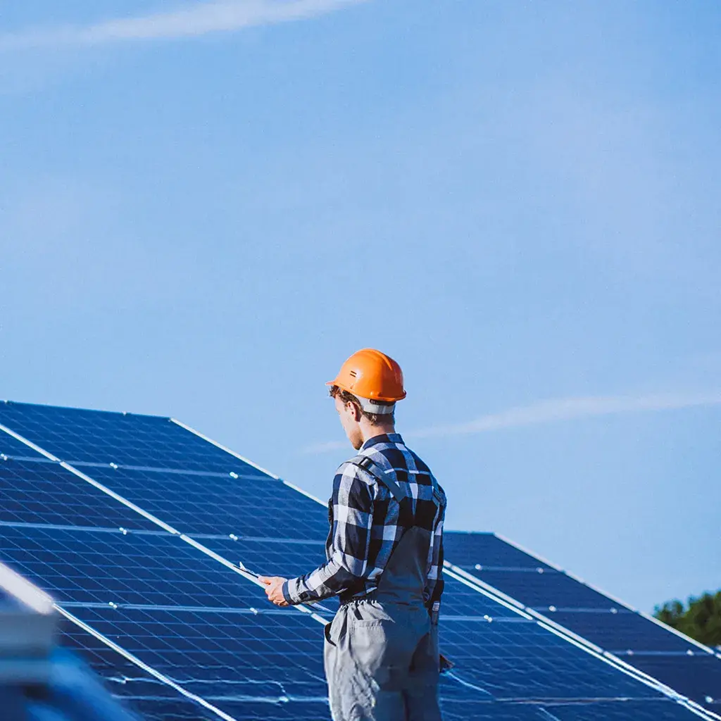 person working on solar panels