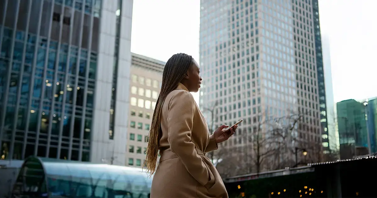 Skyscraper-city-woman-smartphone-featured-image