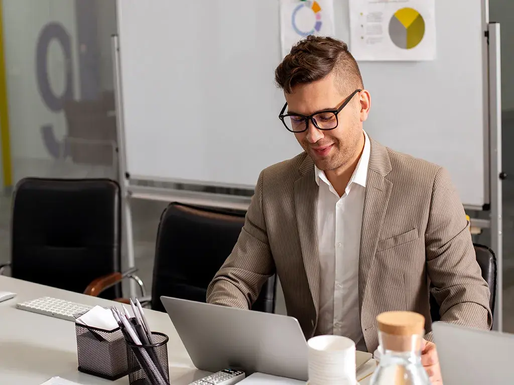 Corporate employee working on asset management model at modern workspace