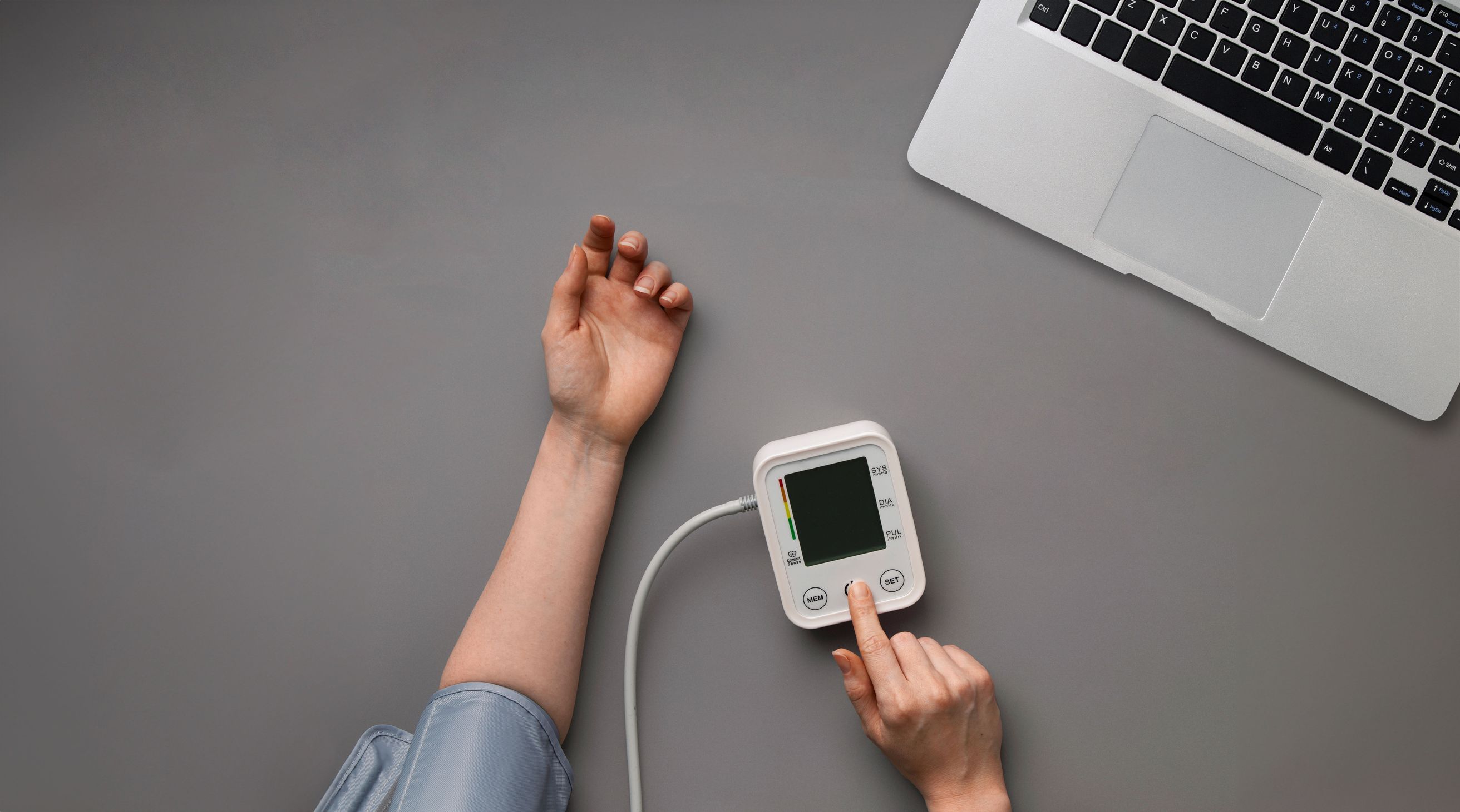Arm with blood pressure monitor