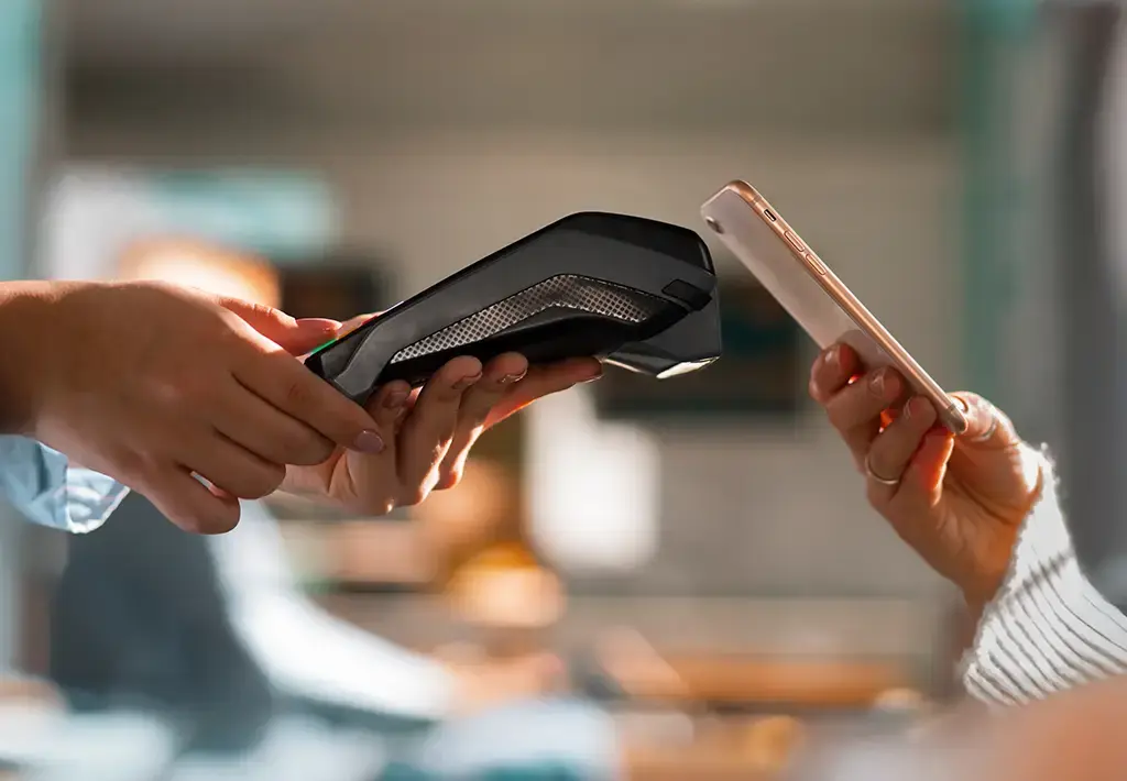 Contactless payment made with smartphone using a wireless point-of-sale terminal.