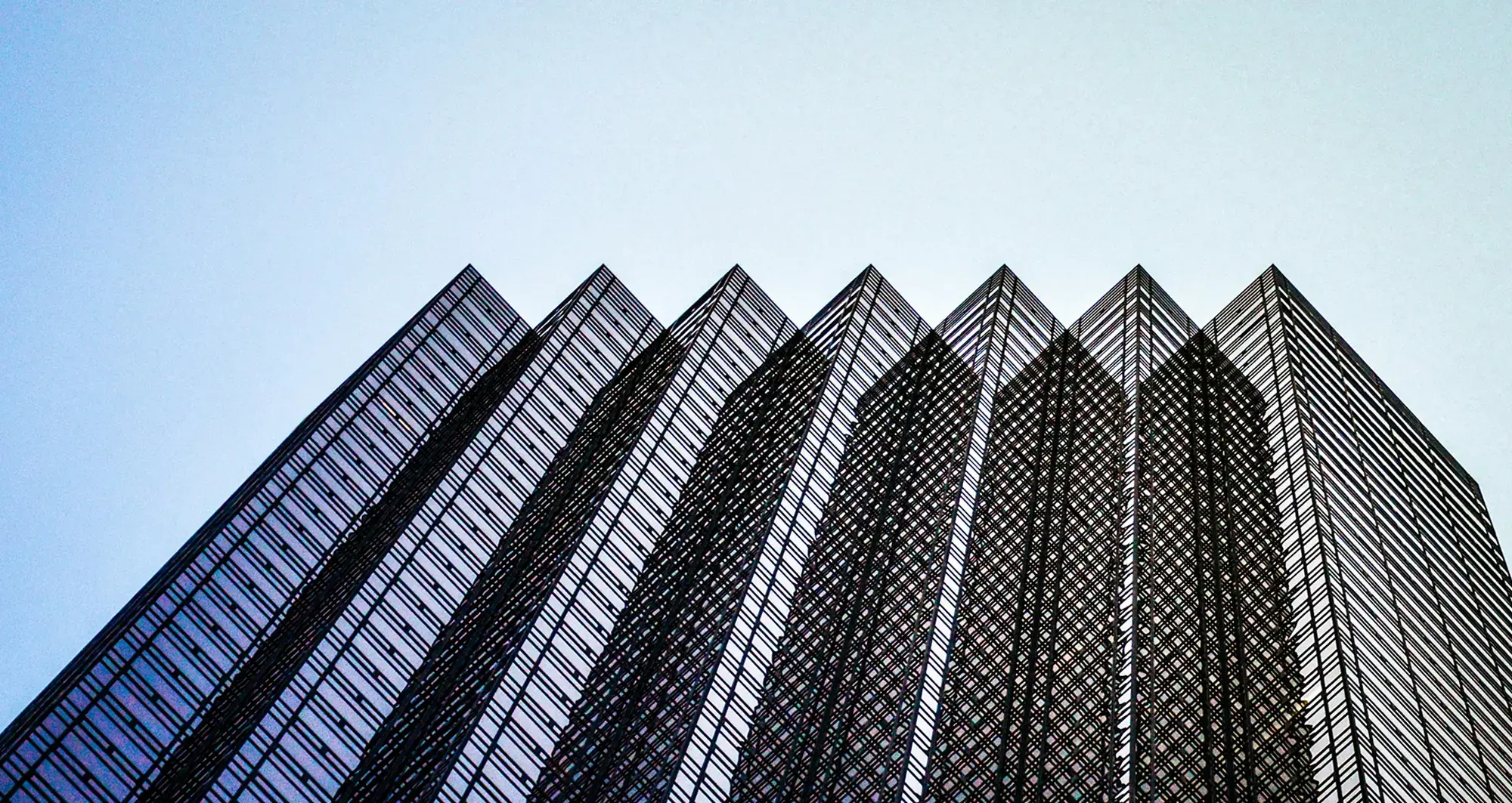 upward-view-of-glass-building-and-sky