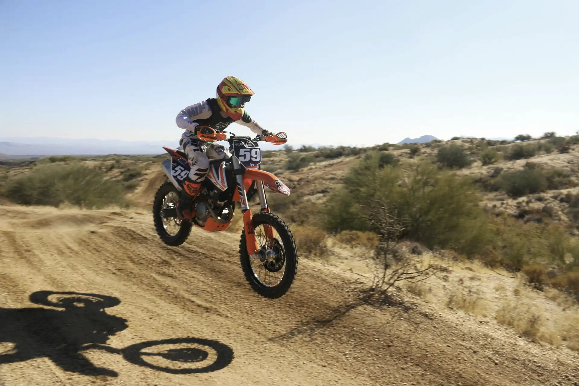 Man riding a motorcycle in the desert
