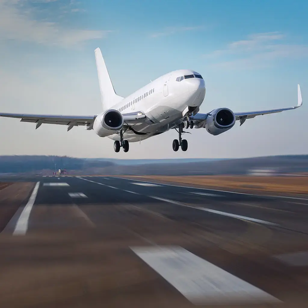 Commercial airplane taking off from runway, symbolizing global travel and transportation technology.