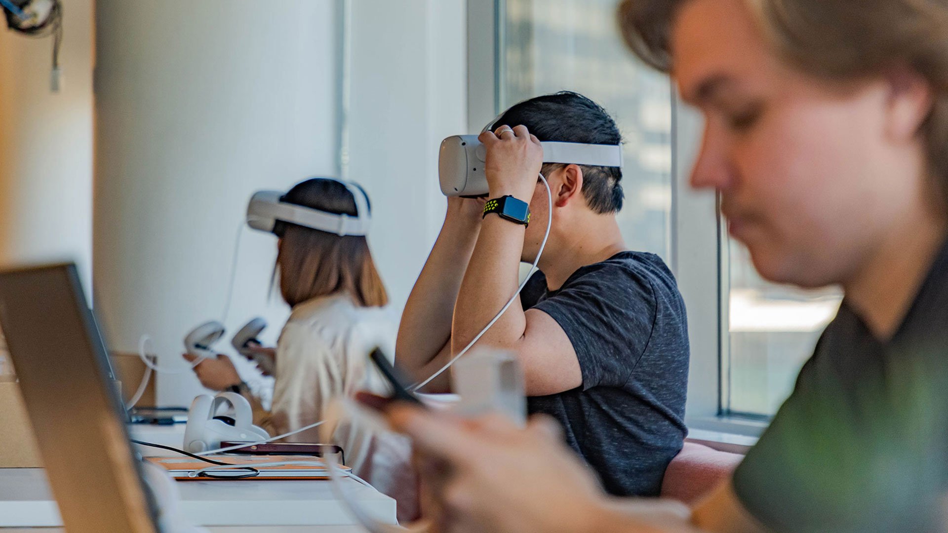 Employees with VR headsets