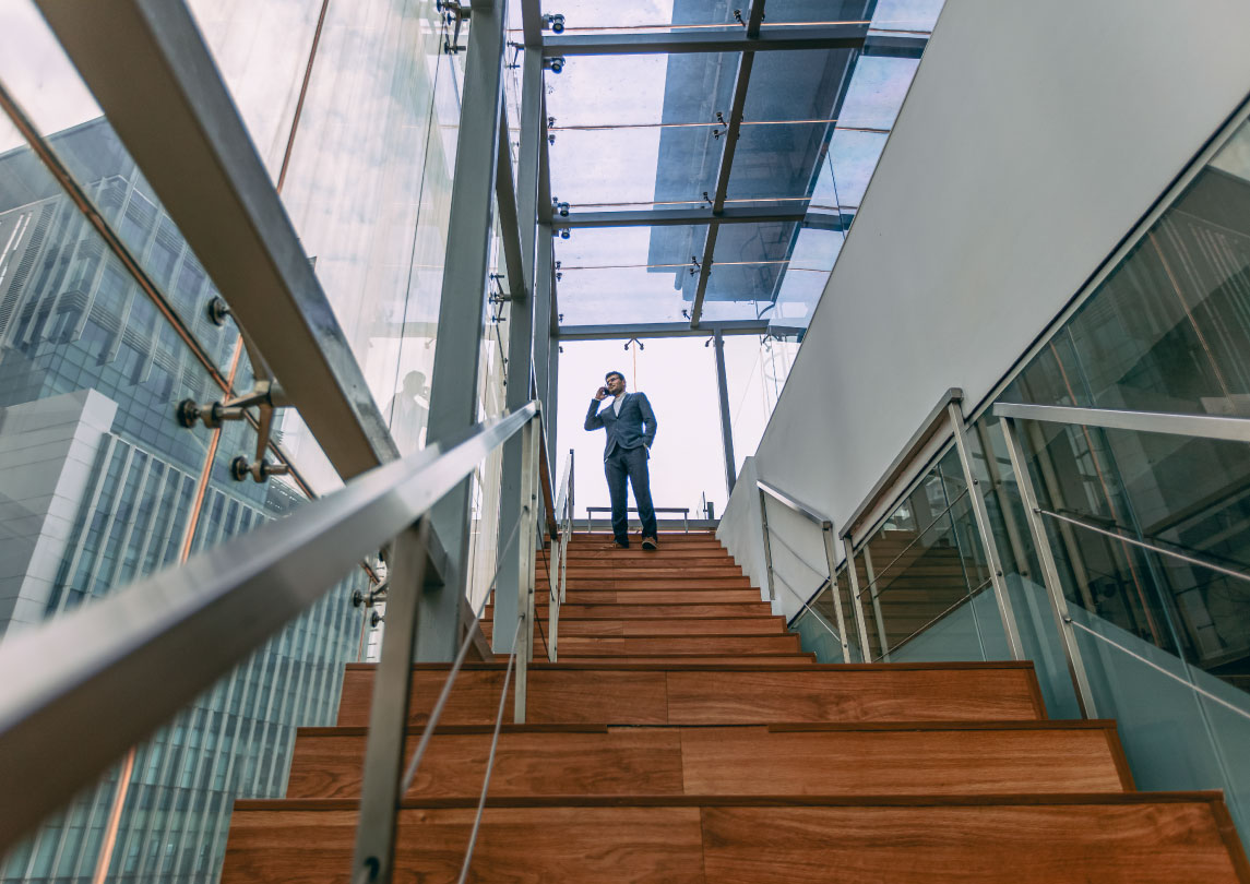 Man in staircase having a phone call