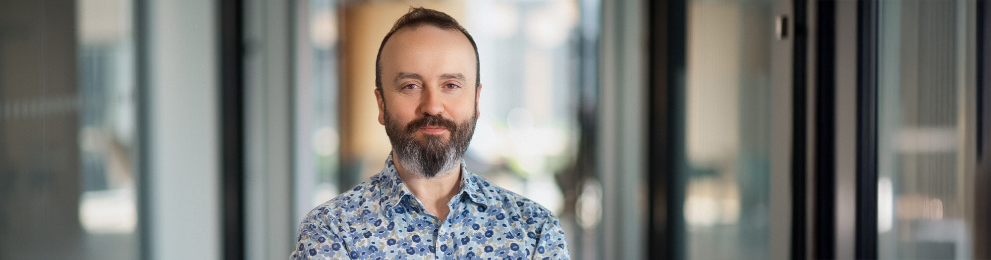 Rob Machin standing in Endava office